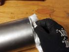 Trim any excess from muffler mat